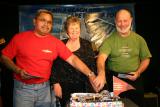 Celebrating 21 years, Neil Anderson and Peter Rawlings of Raw Country with organiser Shirley May/PHOTO Donna Russell